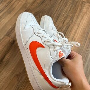 Nikes with orange check